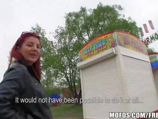 Captivating redhead amateur is fucked in a park for some cash