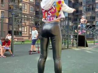 Blonde slattern is showing her leather leggings ass in public!